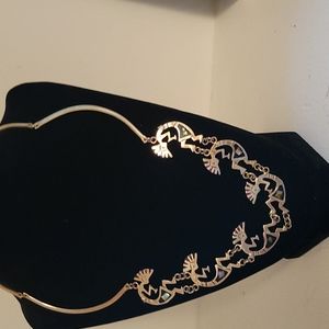Silver kokopelli necklace.